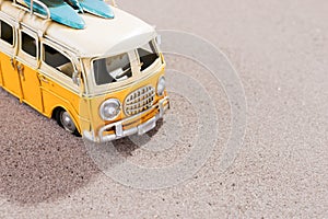 Vintage car with surfboards and rescue ring on the beach