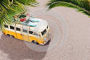 Vintage car with surfboards and rescue ring on the beach