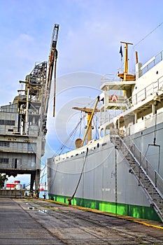 Vintage cargo vessel at dock