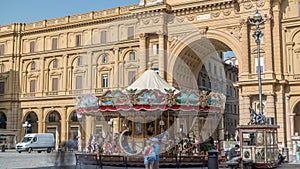 Vintage carousel timelapse and tourists in Piazza della Repubblica in Florence, Italy.