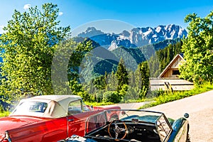 Vintage cars in front of slovenian Alps next to Logar valley, Slovenia