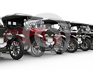 Vintage cars in a row - red stands out
