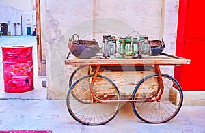 The vintage cart with kerosene lamps and bowls, Al Seef, Dubai, UAE