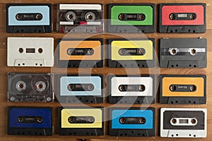 Vintage cassette tapes on wooden table background