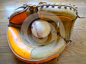 Vintage Catchers mitt with baseball.