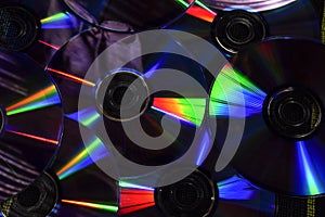 Vintage CD or DVD disk background, old circle discs used for data storage, share movies and music, colorful background