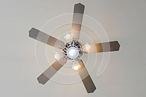 Vintage ceiling fan and lamp on white background