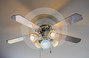 Vintage ceiling fan and lamp on white background