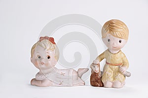 Vintage ceramic doll of boy sheep and baby girl for interior decoration white background