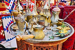 The vintage cezve and dallah coffee pots in antique stall of Al Souk al Kabir Old Market in Dubai, UAE