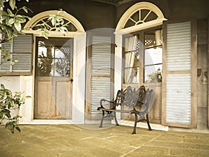 Vintage chair and bulding in glover garden