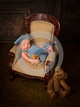 Vintage chair with sleeping newborn baby