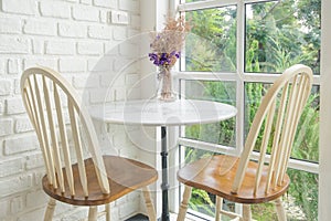 Vintage chair and table and window sill in background