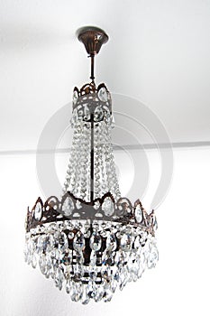 Vintage chandelier hanging on a white roof