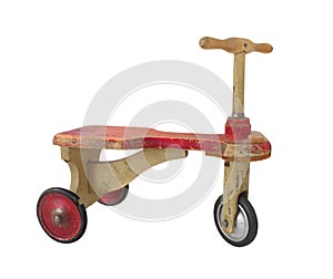 Vintage childâ€™s push-scooter tricycle isolated