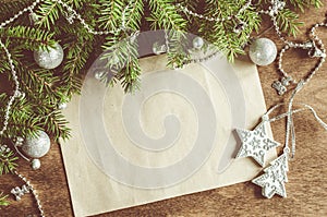 Vintage Christmas background with xmas decoration. Blank postcard on wooden board. Selective focus, space for text.