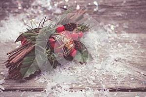 Vintage christmas decoration and snow on wooden background