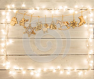 Vintage christmas decoration on wooden table - angel, deer, house, tree, xmas lights and copy space for text