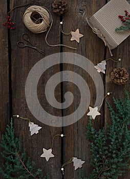 Vintage Christmas frame board of fir branches, cones, gift box, wooden christmas toys