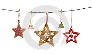 Vintage Christmas stars and bells hanging on string isolated