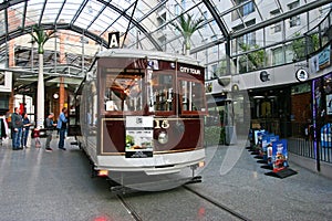 Vintage city tour tram, tramcar, tramway, trolley waiting at indoor tram stop at Cathedral Junction, Christchurch, New Zealand