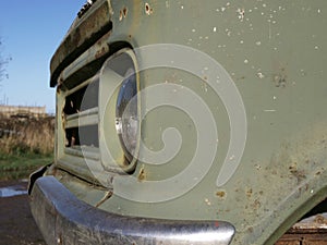 Vintage classic car side view of headlamps medium shot