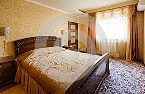 Vintage classic hotel golden bedroom interior