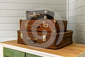 Vintage classic outdated trunks luggage, old antique leather suitcases. Travel baggage concept