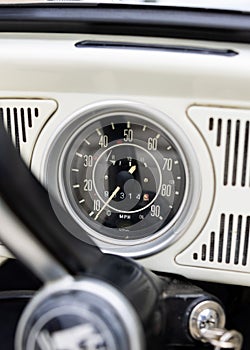 Vintage classic white retro car close up of speedometer with high milage