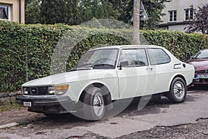 Classic white Saab 99 car parked