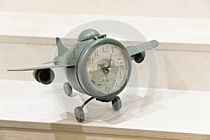 Vintage clock-aircraft. Concept: time flies