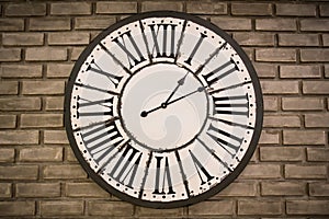 Vintage clock on brick wall