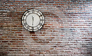 Vintage clock on brick wall background