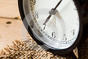 Vintage clock selective focus at number 7 o`clock