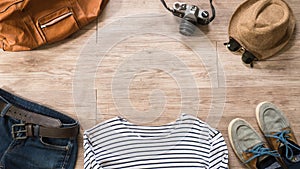 Vintage clothing and accessories on the wooden background photo