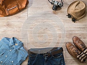 Vintage clothing and accessories on the wooden background photo