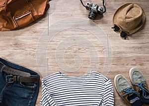 Vintage clothing and accessories on the wooden background photo