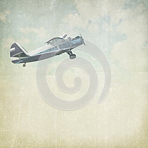 Vintage cloudy background with plane