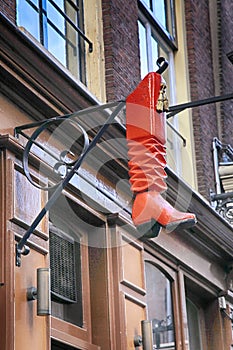 Vintage cobbler shop sign in Amsterdam, Netherlands