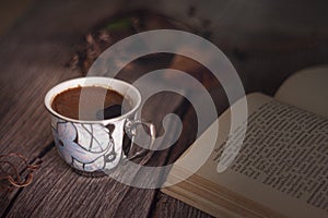 Vintage coffee cup and book