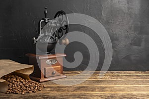 Vintage coffee grinder. Manual coffee grinder for grinding coffee beans on dank background.