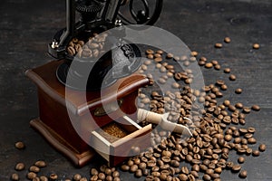 Vintage coffee grinder. Manual coffee grinder for grinding coffee beans on dank background.