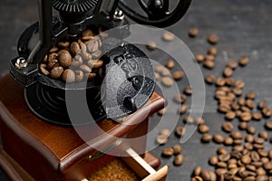 Vintage coffee grinder. Manual coffee grinder for grinding coffee beans on dank background.