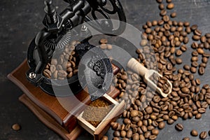 Vintage coffee grinder. Manual coffee grinder for grinding coffee beans on dank background.