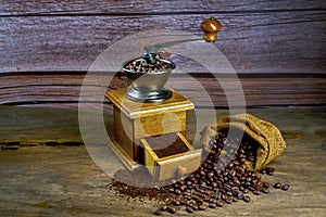 Vintage coffee grinder.Old retro hand-operated wooden and metal coffee grinder.Manual coffee grinder for grinding coffee beans.