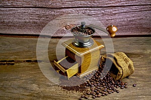 Vintage coffee grinder.Old retro hand-operated wooden and metal coffee grinder.Manual coffee grinder for grinding coffee beans.