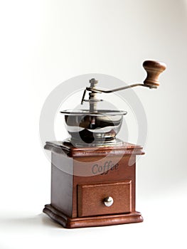 Vintage coffee hand mill on white background