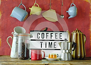 Vintage coffee pots, cups and coffee makers with illuminated sign and slogan Coffee time. Cafe, Restaurant or Coffee concept