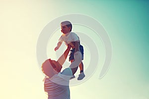 Vintage color photo happy joyful father throws up child