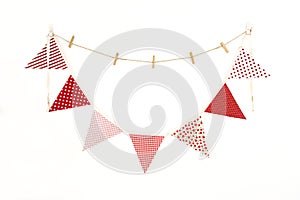 Vintage colorful fabric pennant hanging on the white wall background, Isolated